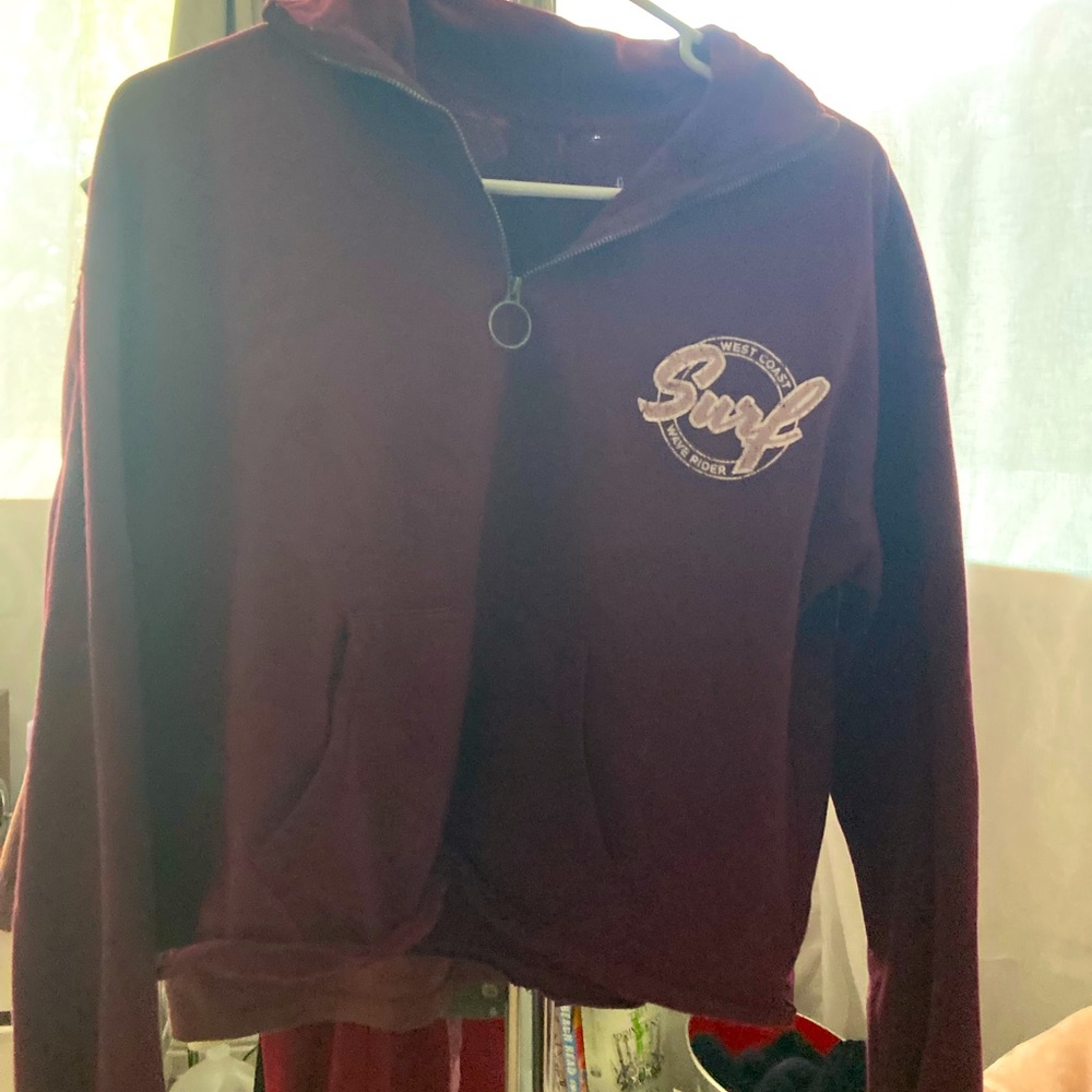 Cropped fleece lined quarter zip sweatshirt.